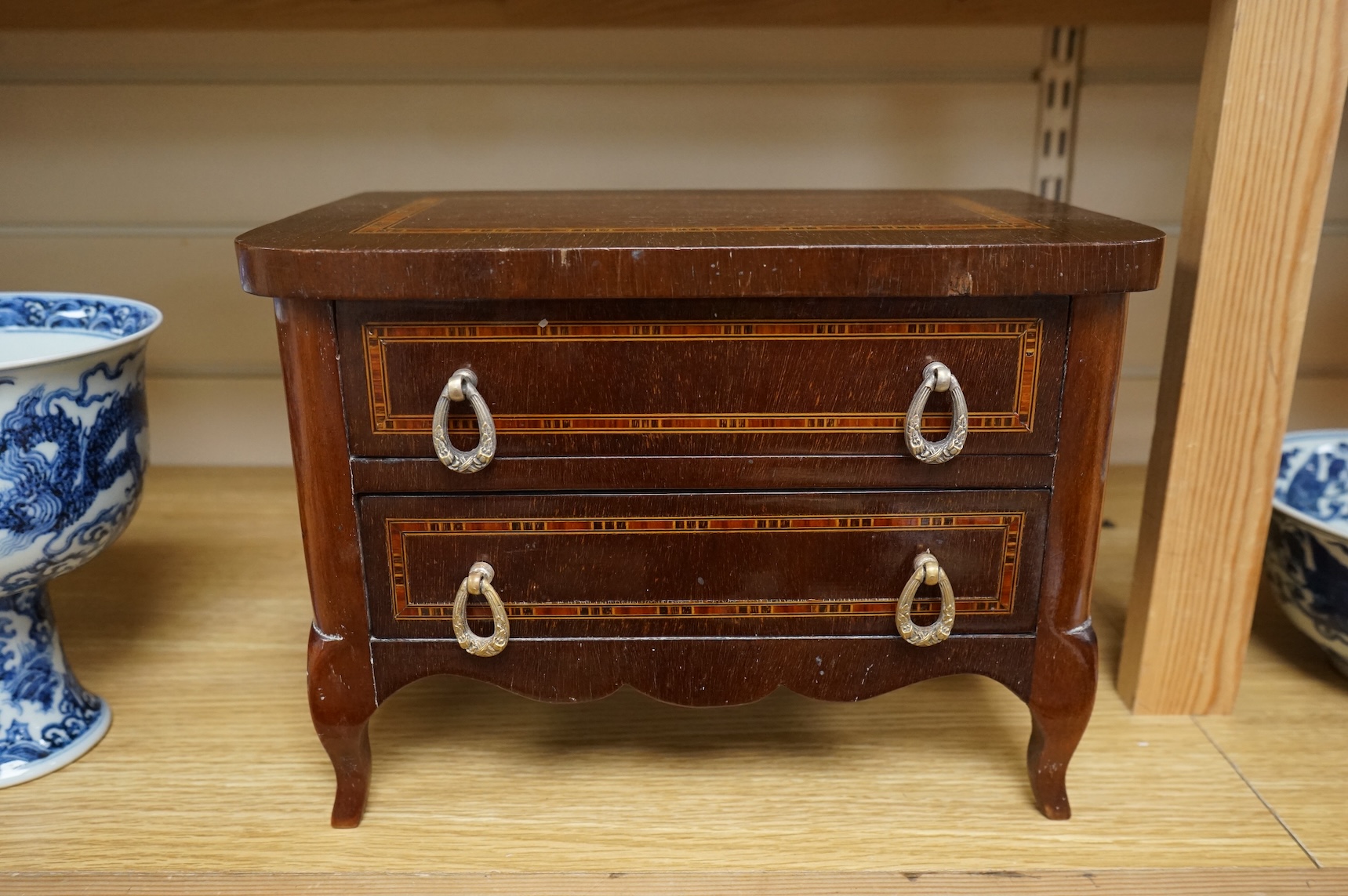 A French miniature lined inlaid mahogany chest of two drawers, 29cm wide